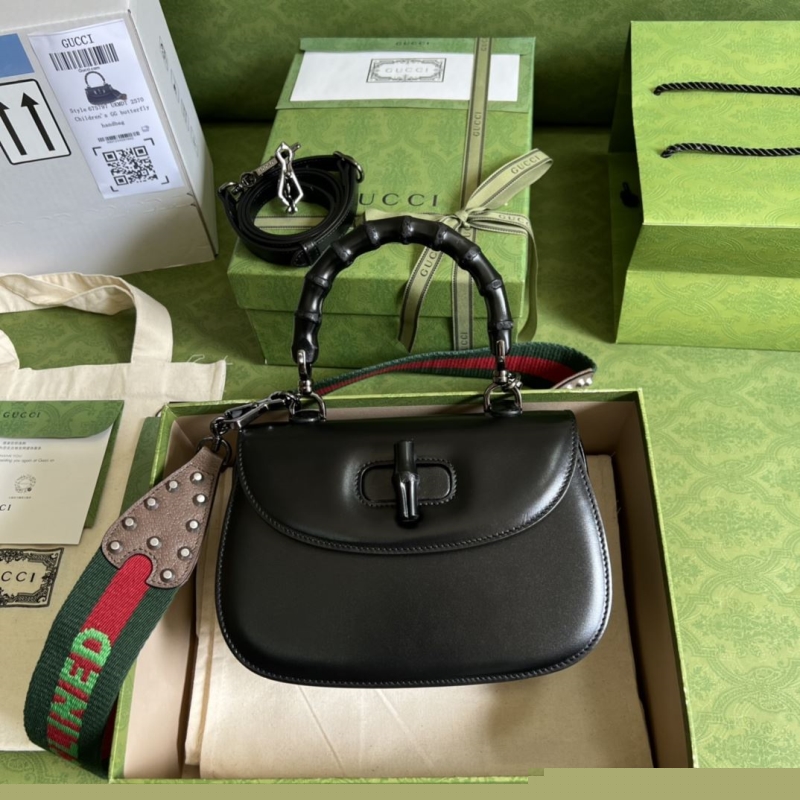 G*u*i top handle bags